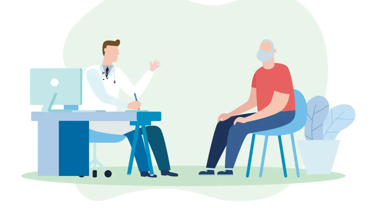 Medico parla con paziente anziano, discutendo possibili sintomi di declino cognitivo.