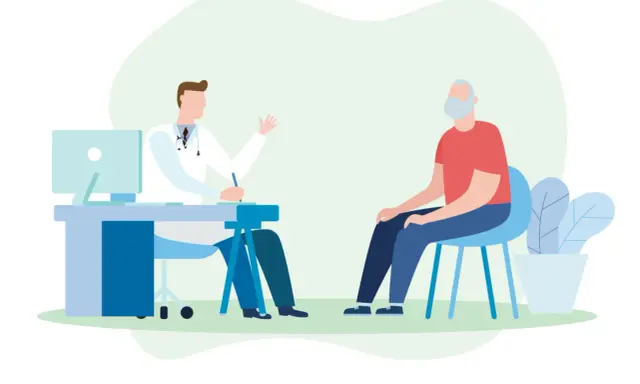 Medico parla con paziente anziano, discutendo possibili sintomi di declino cognitivo.